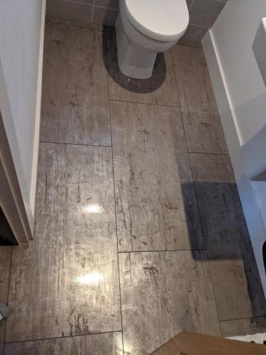 Concrete Effect Vinyl Flooring and Wood Panelled Feature Wall in Worcester