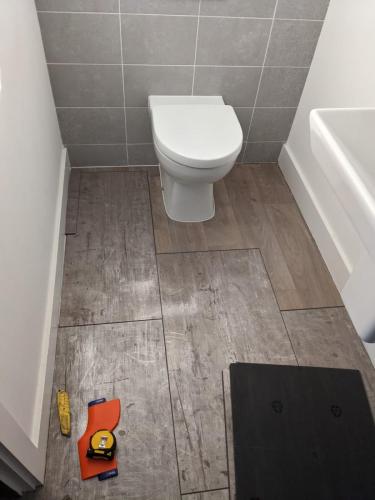 Concrete Effect Vinyl Flooring and Wood Panelled Feature Wall in Worcester